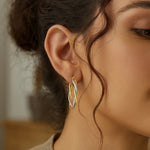 10K Two Tone Gold Oval Twist Hoop Earrings, view 2