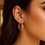 14K Yellow Gold Full Twist Medium Hoop Earrings, view 3