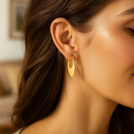 Creole Oval Hoop Earrings in 14K Yellow Gold, view 4